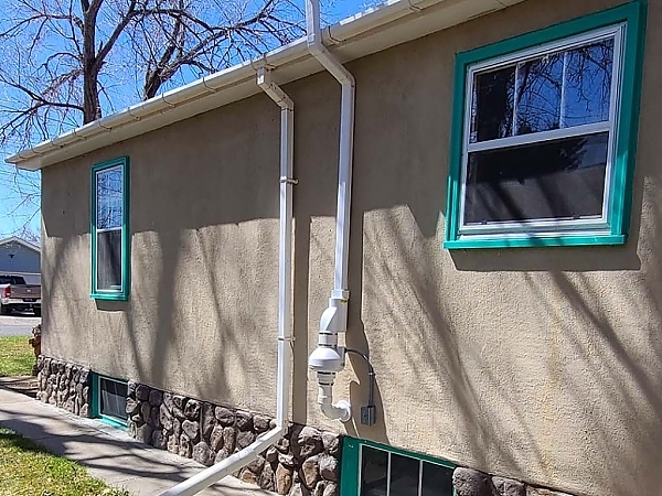 Side view of home radon mitigation