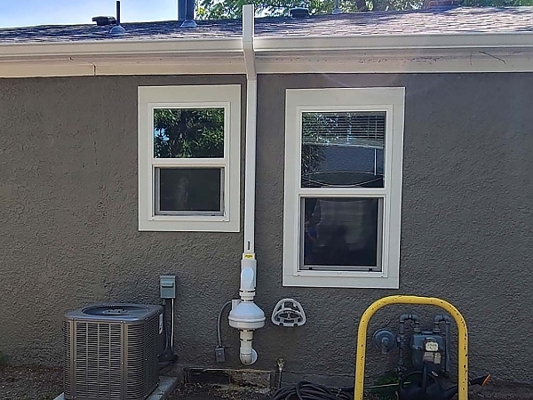 Outside back view of house and HVAC unit tested for radon